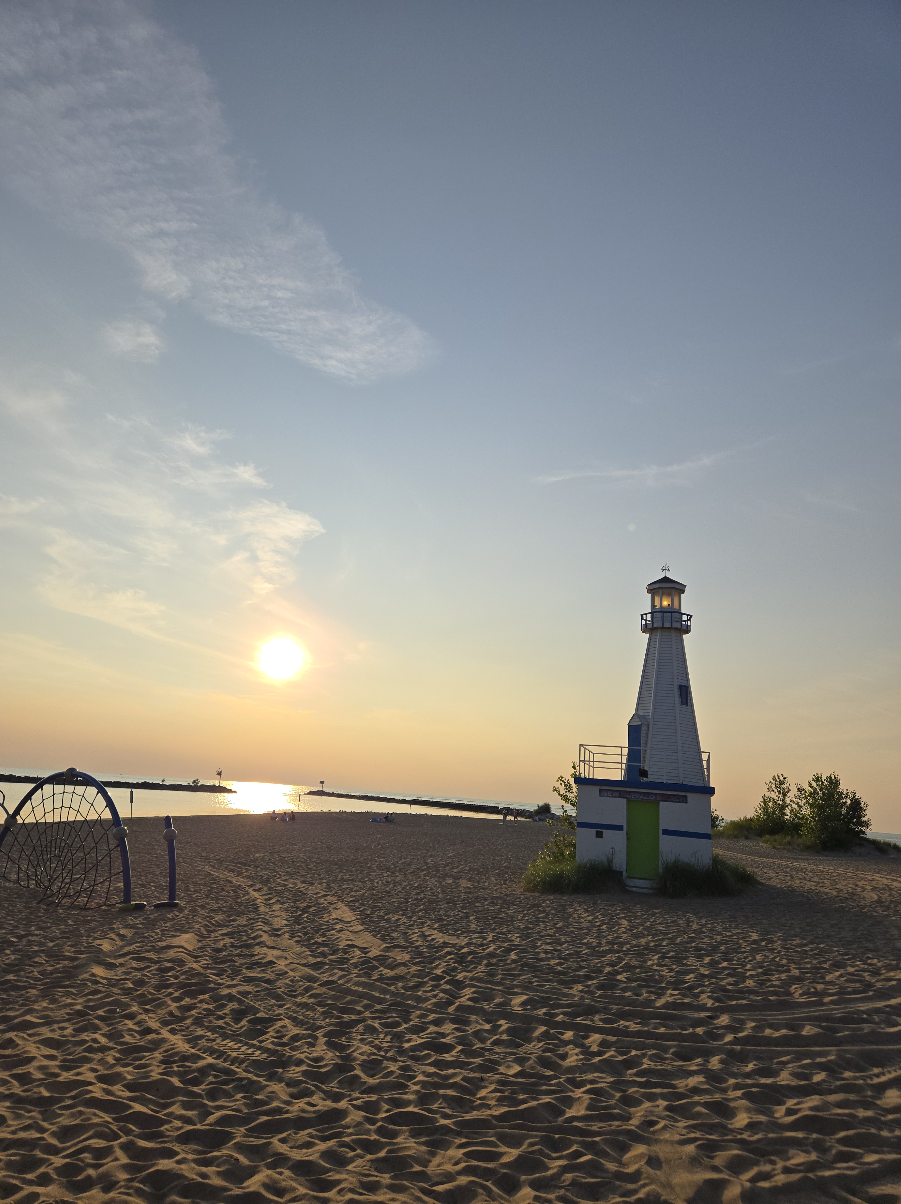 A lighthouse at sunset symbolizing steady direction